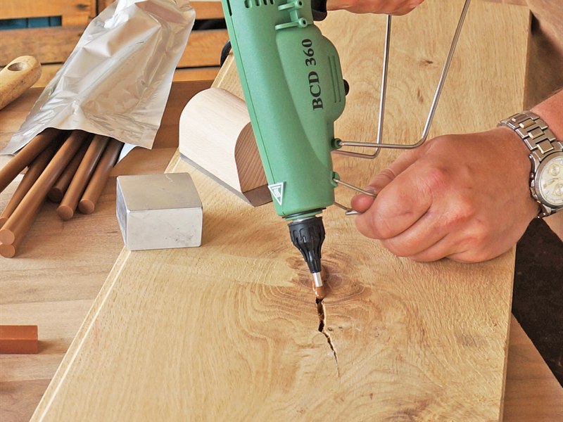 Melt the filler straight into the damage, in oak or any species.