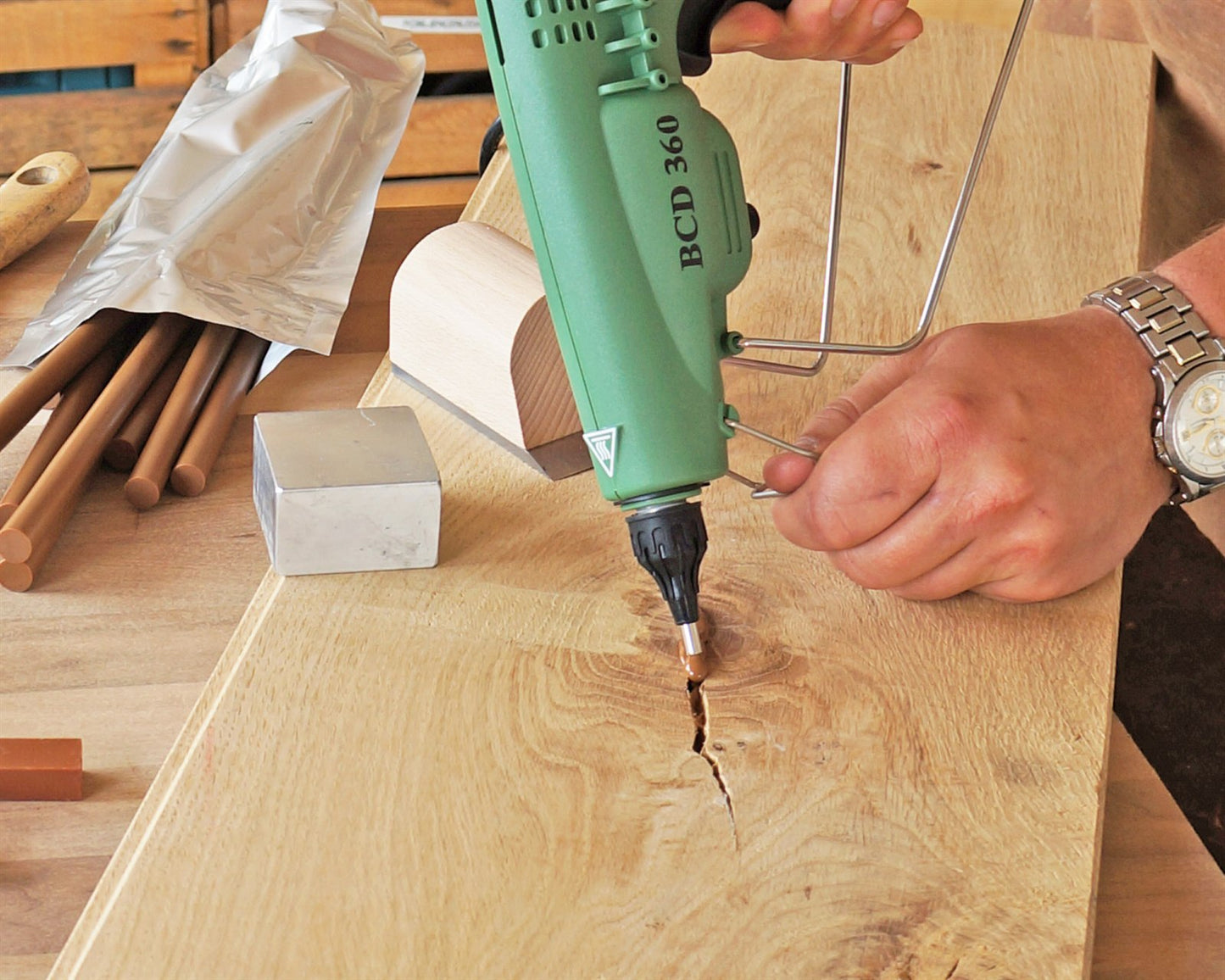 Knot Filler color-matched into a knot on an oak surface