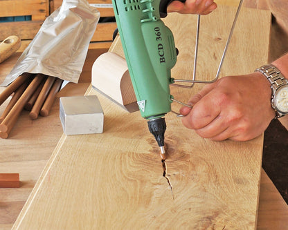 Knot Filler color-matched into a knot on an oak surface
