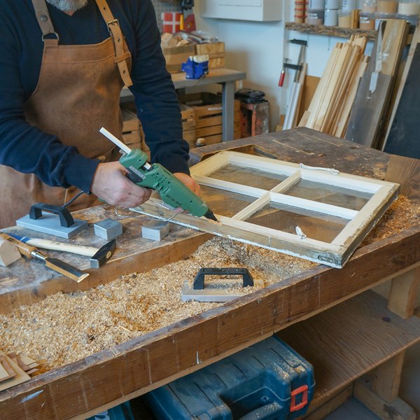 Repaired wooden window frame indoors, finished with solvent-free non-toxic filler