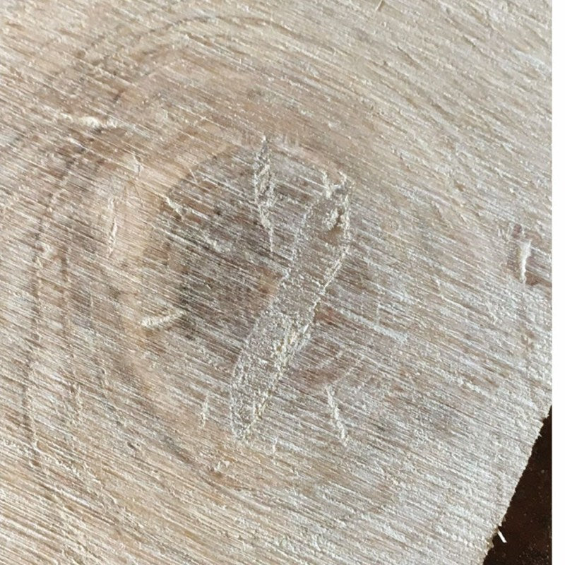 Oak match filler matched into a wood knot, sanded flush